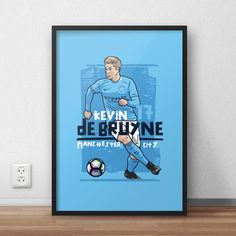 a framed poster of a soccer player kicking a ball