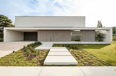 a modern house with concrete steps leading up to it