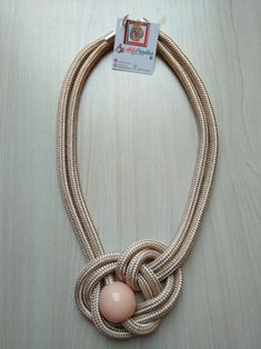 a necklace with an egg in the middle