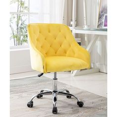 a yellow office chair with chrome wheels in front of a white table and window behind it