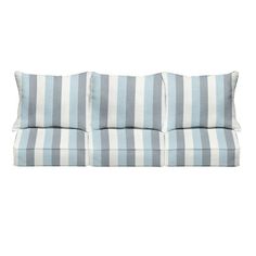 a blue and white striped couch with pillows