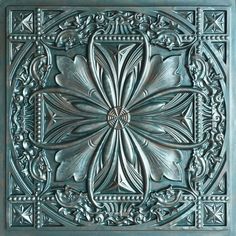 an intricately designed metal wall panel in the shape of a flower