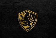 a black and gold wallpaper with a golden dragon on it's shield logo