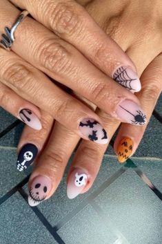 Get ready for the Halloween season with this cute acrylic set! It includes skeletons, ghost, pumpkins, bats, and spiders. Everything you need to make your Halloween nails spooky! Check out our website for a variety of nail supplies to help you create your Halloween nails at home. #halloween #shortnails #mattenails #almondnails #skeleton #pumpkin #bat #nailart #nailidea #naildesign #ghost #nailsupply Biab Nails Halloween, Halloweentown Nails, Halloween Nails Natural, Disneyland Halloween Nails, Bat Halloween Nails, Pastel Halloween Nails, Neutral Halloween Nails, Spooky Nail Designs, Halloween Bat Nails