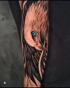 an eagle with blue eyes is shown on the arm and leg, as if it were done