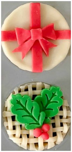 two cookies decorated with icing and bows on top of each other in the shape of christmas wreaths