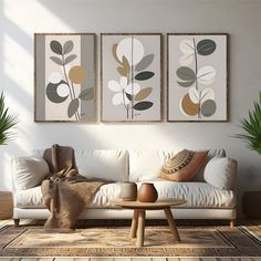 a living room with three paintings on the wall