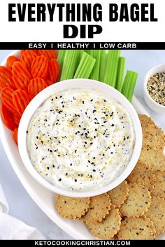 a white plate topped with crackers and dip