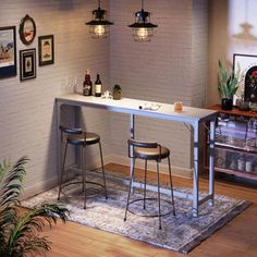 two stools sit at the bar in front of a brick wall with pictures on it