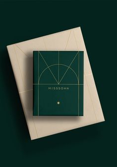 a green book with golden lines on it and the word horoskin written in gold