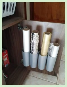 several rolls of duct tape in a cabinet