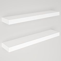 two white floating shelves on the wall