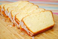 slices of cake sitting on top of a wooden cutting board