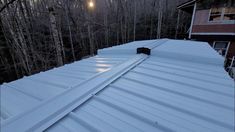 the roof of a house is covered in snow and has no shinning on it