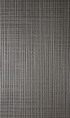 a close up view of the texture of a woven material with lines and dots on it