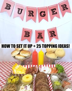 a table topped with lots of food and buns