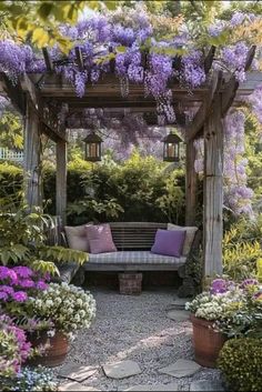 a bench sitting in the middle of a garden with purple flowers on it's arbor