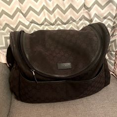 Authentic Black Gucci Diaper Bag. In Great Condition, With Normal Wear On The Outside. Top Flap Is A Little Sun Faded. The Inside Is In Perfect Condition. Includes Trifold Changing Pad Which Fits In The Back Pocket. Purchased From Neiman Marcus. Gucci Diaper Bag, Changing Pad, Gucci Bags, Baby Bag, Back Pocket, Gucci Bag, Neiman Marcus, Diaper Bag, Black Color