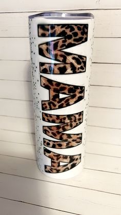 a white and brown leopard print tumbler cup