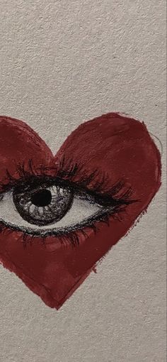 a drawing of a heart with an eye drawn on the side and red lipstick in the shape of a heart