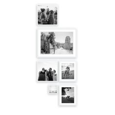 four black and white photos hanging on the wall with people standing in front of them