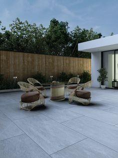 an outdoor patio area with chairs and tables