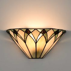 a decorative wall light with an art deco design