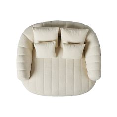 a white chair with two pillows on it's back and the seat cushion is folded up