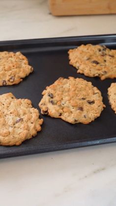 six cookies on a baking tray ready to be baked in the oven or used as an appetizer