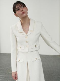 This product is a Merry crop jacket that strikes a perfect balance between modern style and classic design. The jacket features a sharp collar and a cropped length that makes it a versatile layering piece for various outfits. Its front is adorned with button closures and flap pockets that add both functionality and a touch of elegance. - The jacket showcases a structured collar that lends a polished look to any ensemble.- A cropped length provides the versatility to pair with both high-waisted skirts and pants.- Button closures along the front allow for easy fastening while contributing to the garment's aesthetic appeal.- Flap pockets not only enhance the design but also offer practical storage for small essentials. Semi-formal Single-breasted Cropped Jacket, Chic Long Sleeve Cropped Single-breasted Jacket, Chic Single Breasted Cropped Jacket, Chic Single-breasted Cropped Jacket, Chic Cropped Jacket With Suit Collar For Winter, Chic Suit Collar Cropped Jacket For Winter, Spring Formal Cropped Outerwear, Elegant Structured Single Breasted Cropped Jacket, Elegant Structured Single-breasted Cropped Jacket