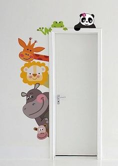 the door is open and there are many cartoon animals painted on the wall behind it