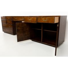 an old desk with two drawers and one drawer open