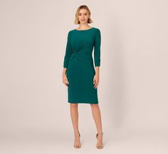 This clever sheath dress uses ruching and beading create subtle texture in its monochrome design with gathering at the elbow and back. At the side waist, a twisted knot detail reveals an inset panel of shimmering sequins and beads for a touch of glam. A knit fabric construction and a back zip create a fitted silhouette. The timeless combination of a boat neck, a three-quarter sleeve, and an above-the-knee hemline make this dress an easy choice for any special occasion. Style Number: AP1D105510 B Elegant Fitted Midi Dress With Twist Front, Elegant Midi-length Twist Front Dress, Elegant Cocktail Bodycon Dress With Ruched Sides, Sheath Dress With Ruched Bodice For Workwear, Formal Knee-length Dress With Ruched Sides, Formal Fitted Dress With Twist Front, Fitted Twist Front Dress For Formal Occasions, Formal Twist Front Dresses, Elegant Evening Dress With Twist Front