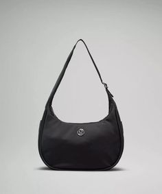 The lululemon mini shoulder bag is rarely in stock, but right now, you can scoop it up in *two* colors (black and green). Here's everything you need to know about the sporty chic purse, which has racked up more than 4 million views on TikTok. Chic Purses, Mini Shoulder Bag, Sporty Chic, Day Bag, Back In Stock, Body Fit, Belt Bag