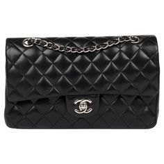 Chanel Black Quilted Lambskin Medium Classic Double Flap Bag Brand- Chanel Model- Medium Classic Double Flap Bag Product Type- Crossbody, Shoulder Serial Number- 10****** Age- Circa 2005 Accompanied By- Chanel Dust Bag, Box, Authenticity Card Colour- Black Hardware- Silver Material(s)- Lambskin Leather Authenticity Details- Serial Sticker, Authenticity Card Height- 15cm Width- 25cm Depth- 7cm Strap Drop- Single: 24cm Double: 43cm Interior- Burgundy Leather Closure- Turn Lock Country of Origin- F Chanel Double Flap Bag, Number 10, Chanel Model, Black Quilt, Chanel Black, Black Hardware, Flap Bag, Lambskin Leather, Fashion Handbags