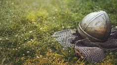 a metal ball sitting on top of a blanket in the grass