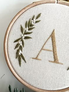 an embroidered monogram with the letter a on it