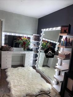 a white fur rug sitting on top of a hard wood floor next to a mirror