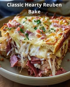 a close up of a plate of food with ham and cheese on it that says classic hearty reuben bake