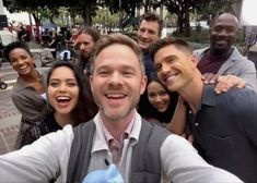 a group of people taking a selfie together