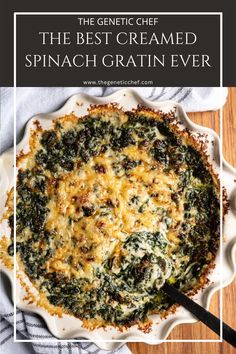 the best creamed spinach gratin ever in a white dish on a wooden table