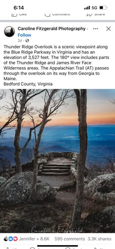 an image of a scenic view from the top of a mountain at sunset or dawn