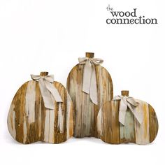 three wooden pumpkins sitting next to each other on top of a white background with the words wood connection written above them