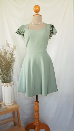 Sage Green Square Neckline Dress, Square Neck Ruffle Dress For Banquets, Square Neck Ruffled Dress For Banquet, Summer Fairy Bridesmaid Dress, Green A-line Dress With Fitted Bodice, Summer Bridesmaid Fairy Dress, Banquet Dress With Ruffles And Fitted Bodice, Fitted Bodice Banquet Dress With Ruffles, Fitted Bodice Dress With Ruffles For Banquet