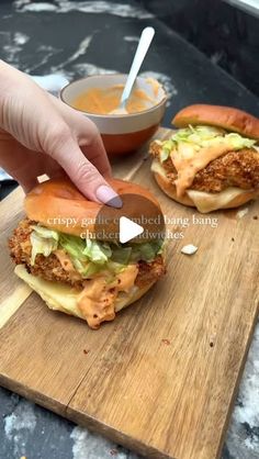 Alex Hughes | Fitness & Food on Instagram: "Crispy Garlic Crumbed Bang Bang Chicken Sandwiches 🥵

WOW seriously sprint to make these because they are BANGING 😱 The chicken is coated in a garlic crumb for an extra burst of flavour, paired with a bang bang sauce, melted cheese and shredded lettuce for a quick and easy dinner 🤤

AND ‼️If you want more easy banging recipes like this 🙏🏼 please pre order my new book ‘Low Cal Kitchen Bangers’ through my bio 💕 less than 2 and 1/2 weeks to go 😆

Ingredients (serves 2): 
7g light butter 
Tsp chopped garlic 
25g panko breadcrumbs
2 x 100g chicken breast 
Salt 
Pepper 
Tsp garlic granules 
Tsp smoked paprika 
Medium whisked egg 
2 half fat cheddar slices 
Brioche buns 
A few chilli flakes to garnish 
Handful of shredded lettuce 

Bang Bang Sauc Bang Bang Sauce, Great Breakfast Ideas, Bang Bang Chicken, Crispy Garlic, Chicken Sandwiches, Protein Meals, Quick And Easy Dinner