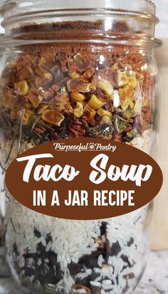 a jar full of taco soup with text overlay that reads, she's stable meal in a jar