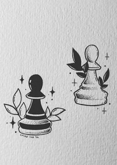 two black and white chess pieces with leaves on them