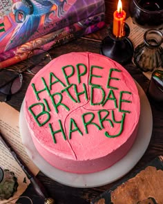 a birthday cake with the words happy birthday harry written in green frosting on it