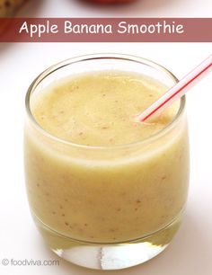 an apple banana smoothie in a glass with a straw