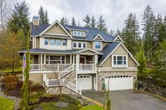 a large house in the middle of a wooded area